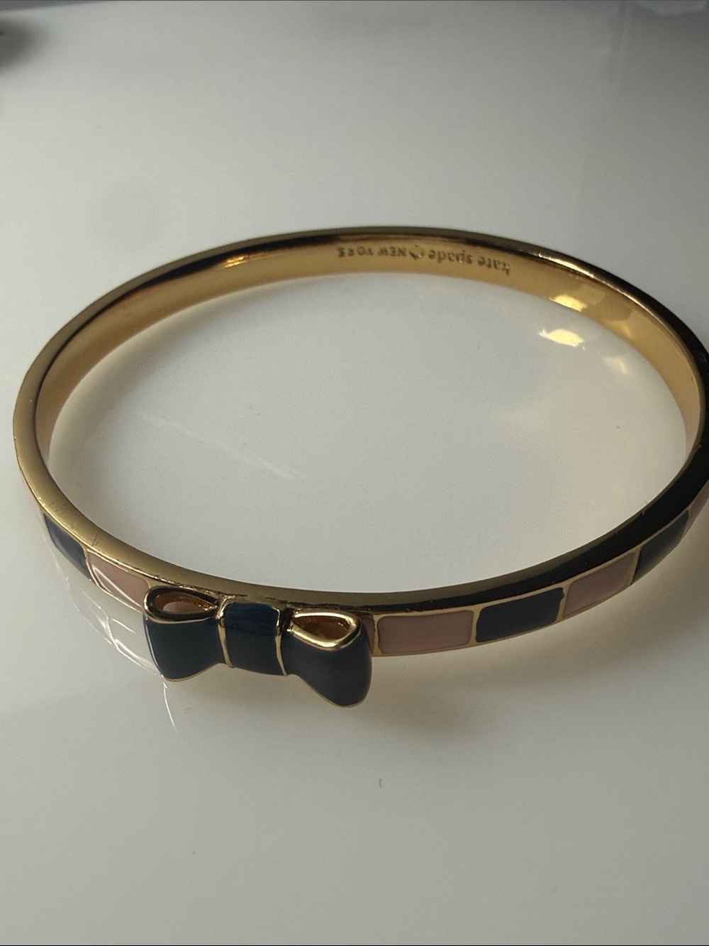 kate spade Gold-Tone Bangle with Navy and Blush Enamel Bow Accent